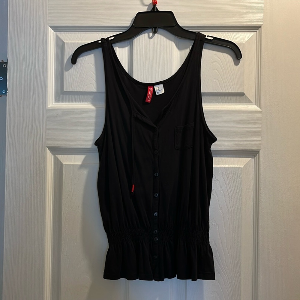 Black tank top with buttons.